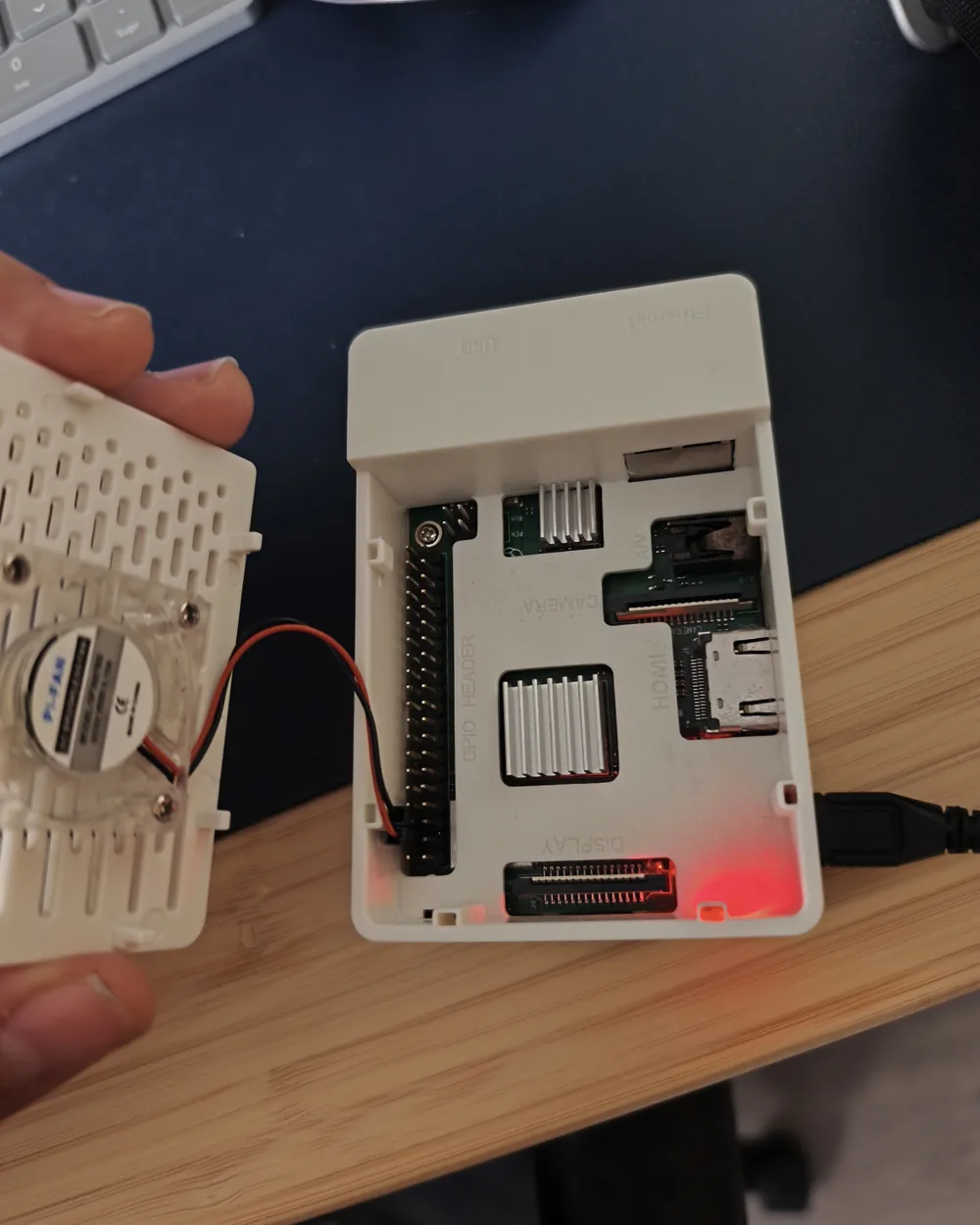 The Pi case opened, showing the board inside